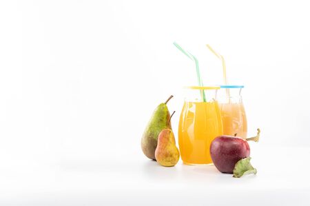 Two fruit drinks. Red apple and green pears.の写真素材