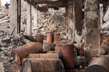 A lot of old gas barrels. Oil barrels. Abandoned basement. Disaster and ruins.の写真素材