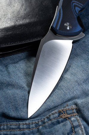 Blade in the shape of a spade. Blade of a knife at an angle. Vertical frame.