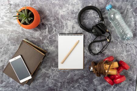 Training planning. Make a workout schedule. Fitness schedule for a week. Fitness dumbbells and jump rope.の写真素材