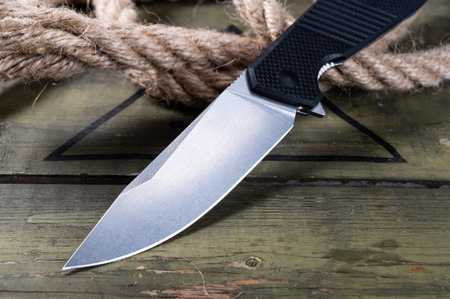 Blade of a knife at an angle close up. Macro photo of a knife blade.