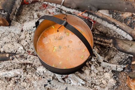 Cook pea soup at the stake. Buryak soup in a cauldron at the stake.の写真素材