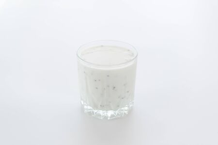 Milk shake with chia seeds. Glass of milk on a white background.の写真素材