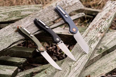 Comparison of several knives. Several knives in a row. Showcase of knives.