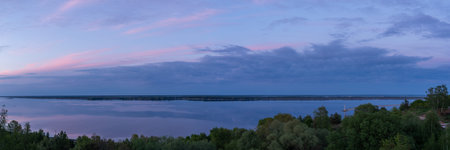 Panoramic photo of nature by the water. Panorama at sunset.