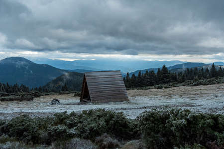 Wooden comfort in the snowy mountains. A place to relax in the mountains.の写真素材