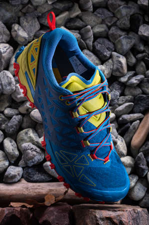 Athletic running shoes. Trekking shoes. Still life with sneakers. Vertical frame.の写真素材