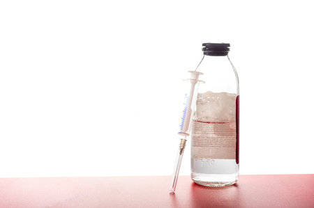 Medical syringe with a needle and a vaccine. Medicine and injection.