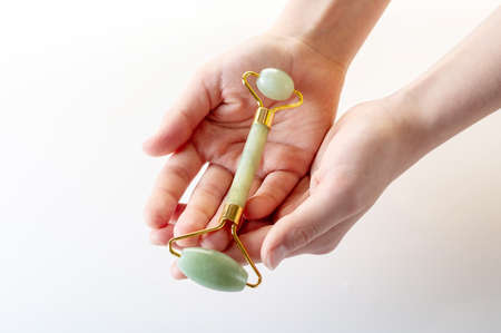 Rollers for massage of the face and body in the hands. Give cosmetic devices. Top.の写真素材