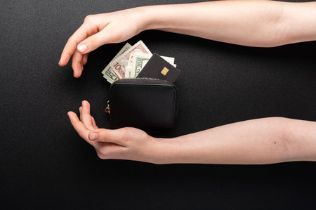 Money and credit card in the wallet. Wallet with money in hand. Accumulate money. Save money. Top.