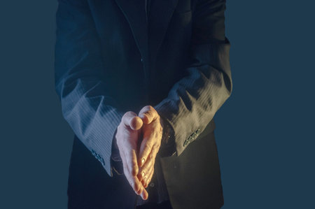The man in the suit claps his hands. Mans hands close up. Isolate.の写真素材