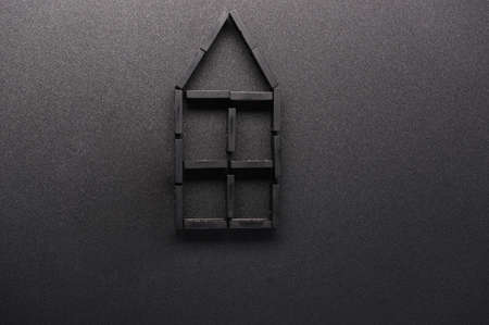 House built from dominoes. House construction. Planning the structure of the house.の写真素材
