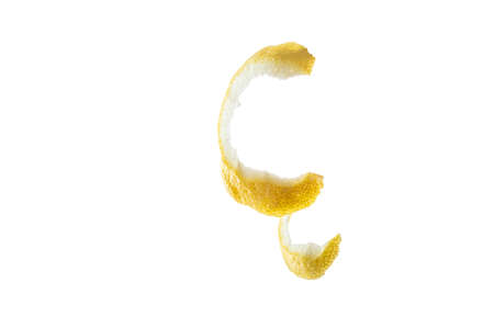 Peeled lemon peel isolate. Lemon peel on a white background. Thin skin of a lemon.の写真素材