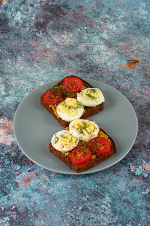 Serving diet sandwiches on a plate. Sandwiches with eggs and French mustard.の写真素材