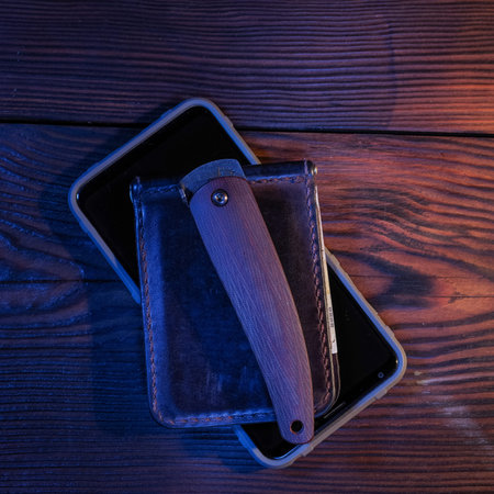 Folded pocket knife. Pocket knife and wallet.