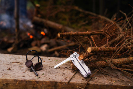 Hiking tool. Pocket tool. Light a fire in the forest. Outdoors.