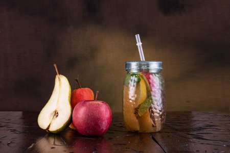 Drink in a modern can with a straw. Vibe glass and drink. Fresh apple juice.の写真素材