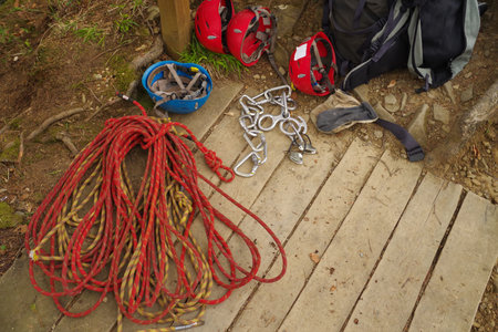 Mountaineering and rock climbing equipment. Safety rope and carabiners. Repair and installation...