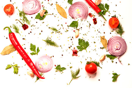 Various vegetables on a white background. Chopped vegetables and spices on a white background. Cooking and preparation.の写真素材