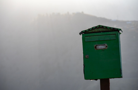 Old green metal mailboxの写真素材