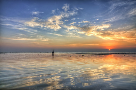 Reflection of sunset on seaの写真素材