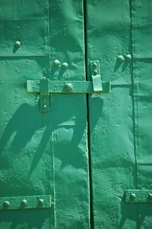 green metal window shutter