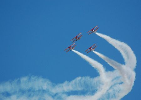 biplanes in formation at airshow