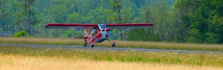 bush plane landing on remote airstrip