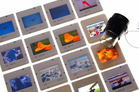 slides on lightbox with loupeの写真素材