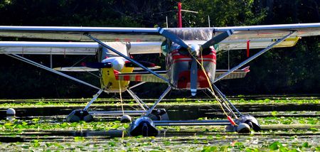 tow seaplanes on a lake