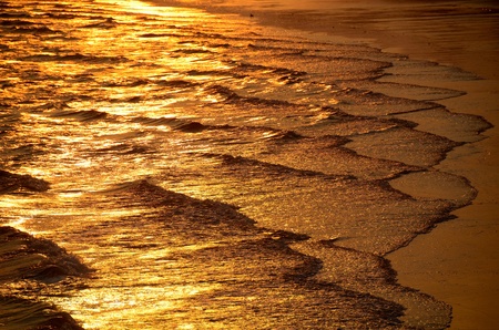 ocean waves at sunsetの写真素材