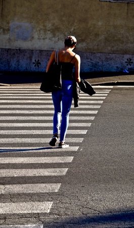 woman in a city crosswalkの写真素材