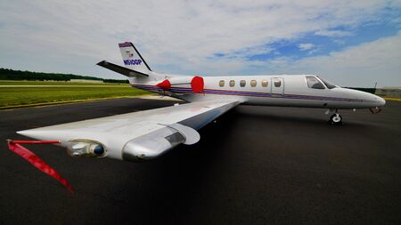 executive aircraft parked on airport ramp