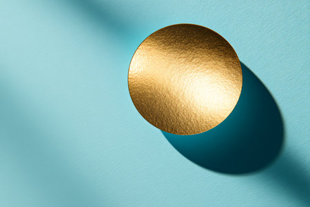 Golden egg on a blue background. Minimalism concept. 3D Renderingの素材