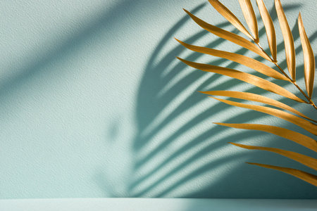 Tropical palm leaf shadow on turquoise wall with copy spaceの素材