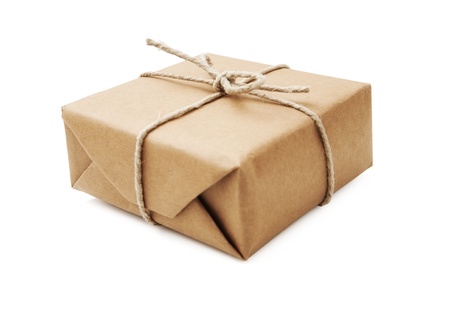 Parcel wrapped with brown paper and tied with stringの写真素材