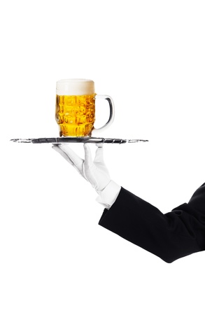 Waiter holding a tray with a beer glassの写真素材