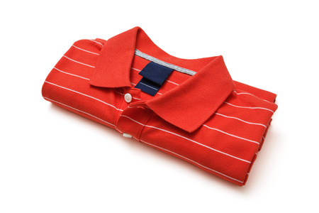 Folded red polo t-shirt isolated on white -Clipping Pathの写真素材