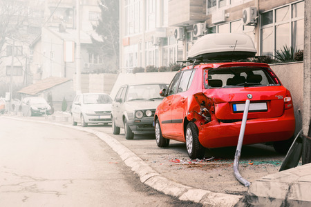 VRANJE, SERBIA, 03.01.2017 -Damaged car on the sidewalk outside the buildingのeditorial素材