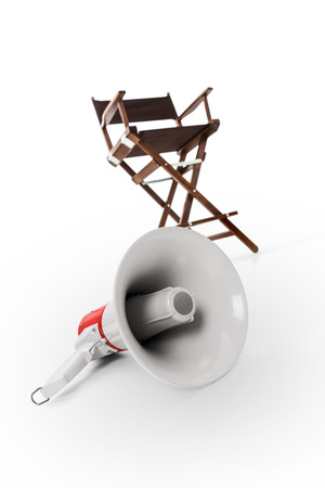 Megaphone and director chair in background -Clipping Pathの写真素材