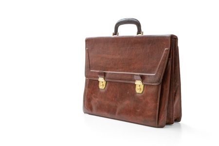 Brown leather briefcase with brass buckle on white, included clipping pathの写真素材
