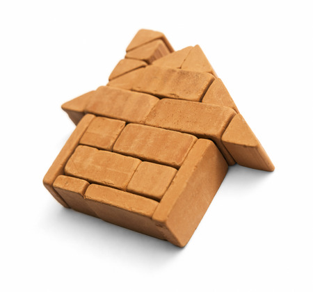 House made of bricks. Building from toy brick on white background, including clipping path