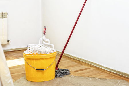 Renovation of the house, Bucket and roller in room during renovationの写真素材