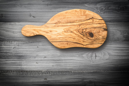 Wooden kitchen board on table, copy spaceの写真素材