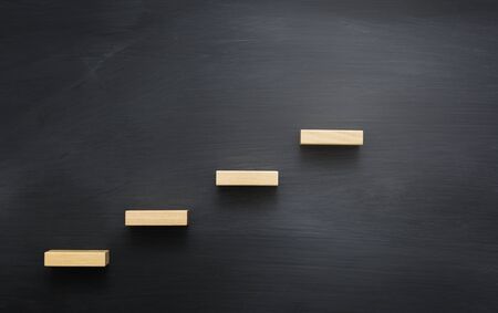 Blackboard with a concept of stairs to successの写真素材