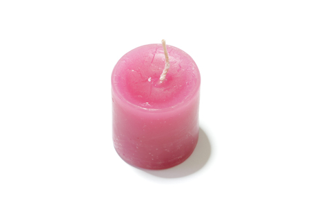 Candle light on the white backgroundの写真素材