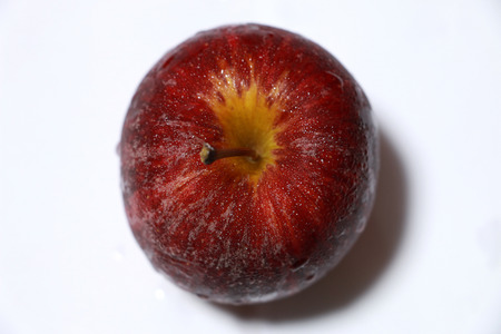 Apple with drop water on the white backgroundの写真素材