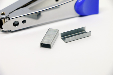 Stapler on the white background. Miscellaneous of office equipment. Paper clip,Staplerの写真素材