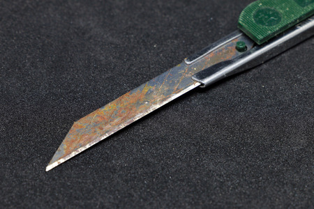 Cutter blade on the black backgroundの写真素材