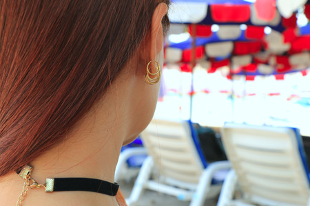 Beautiful back women with decorations on the bokeh backgroundの写真素材